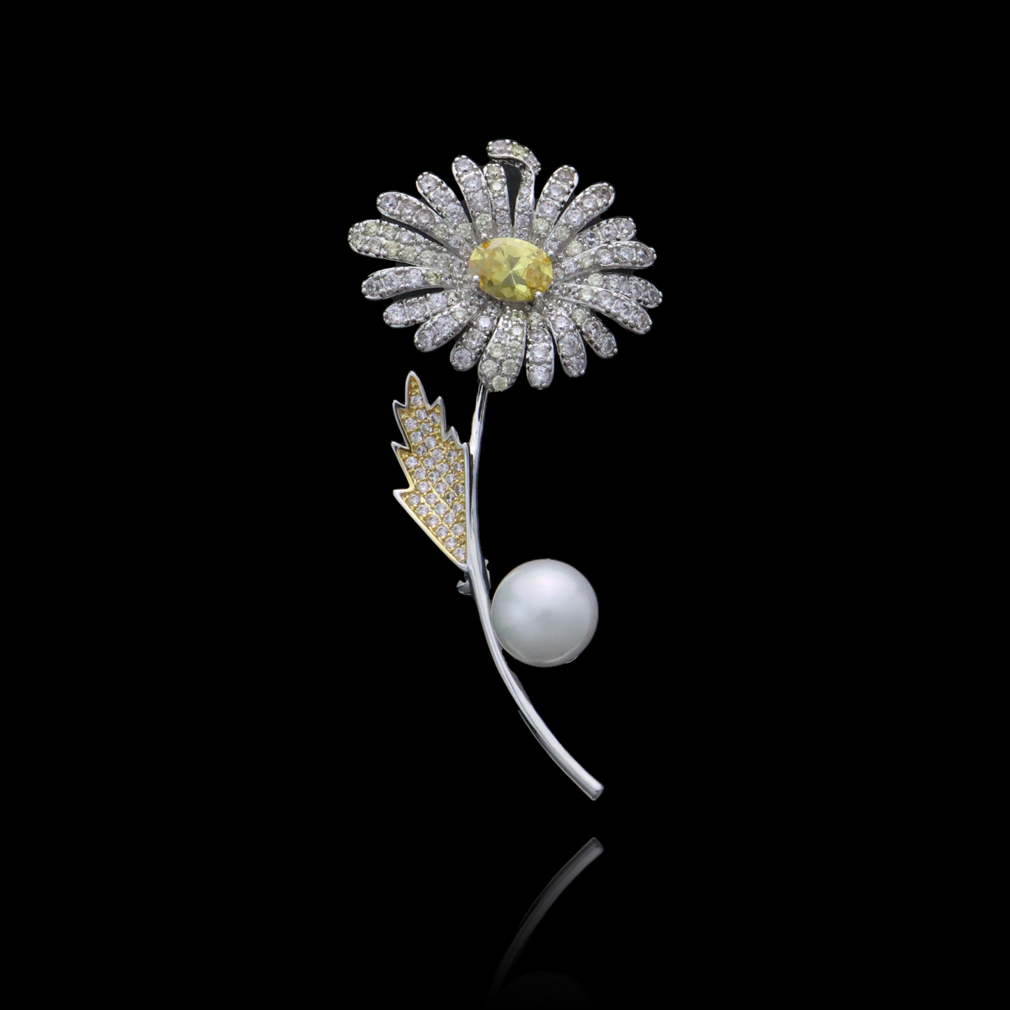 Chic daisy brooch with a yellow gem center, diamond petals, and a pearl accent