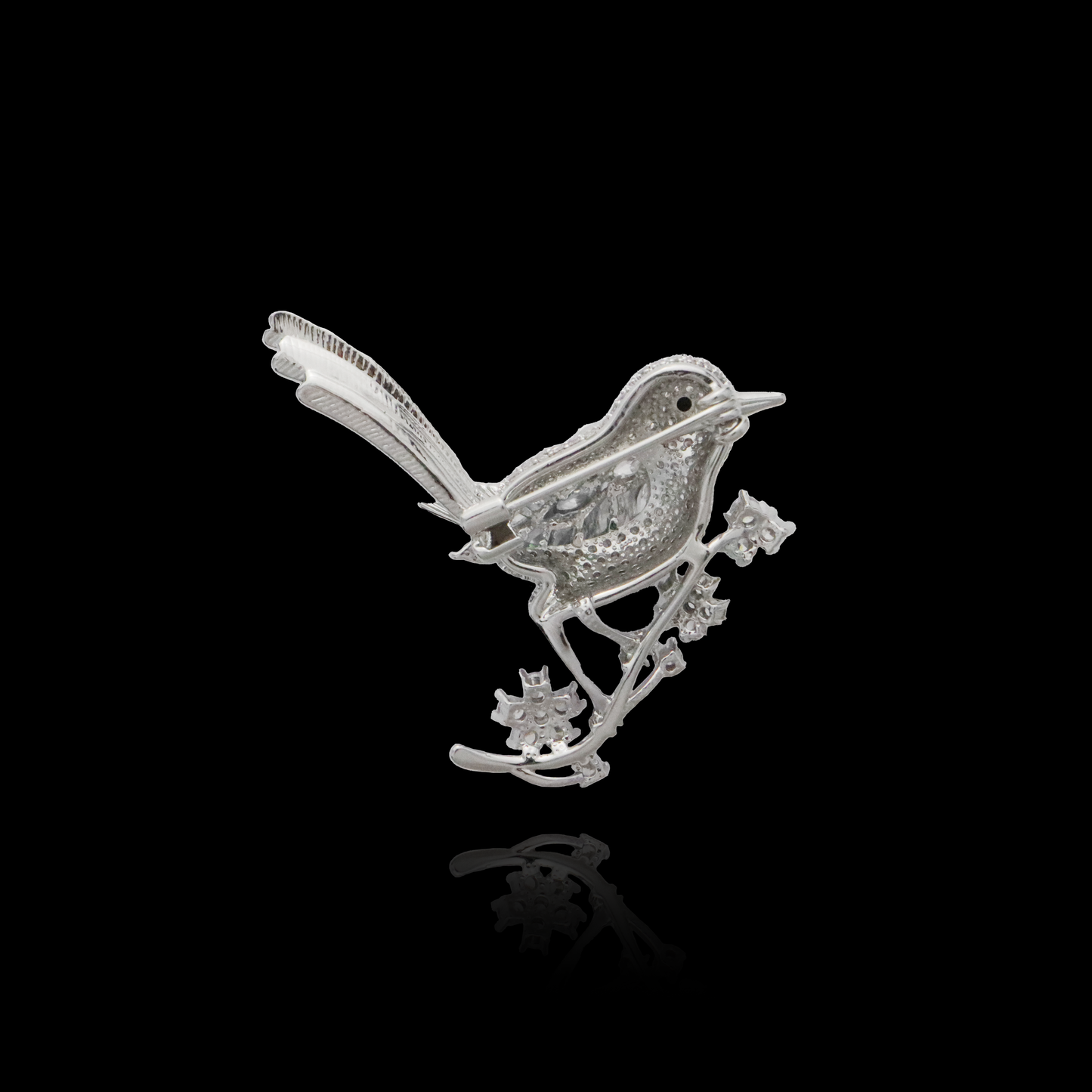 Jeweled bird brooch with glistening marquise diamonds set in silver