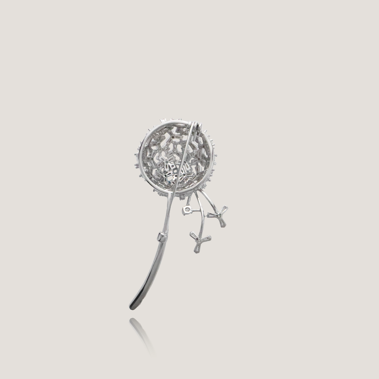 Sleek botanical pin featuring a silver globe and delicate crystal flowers