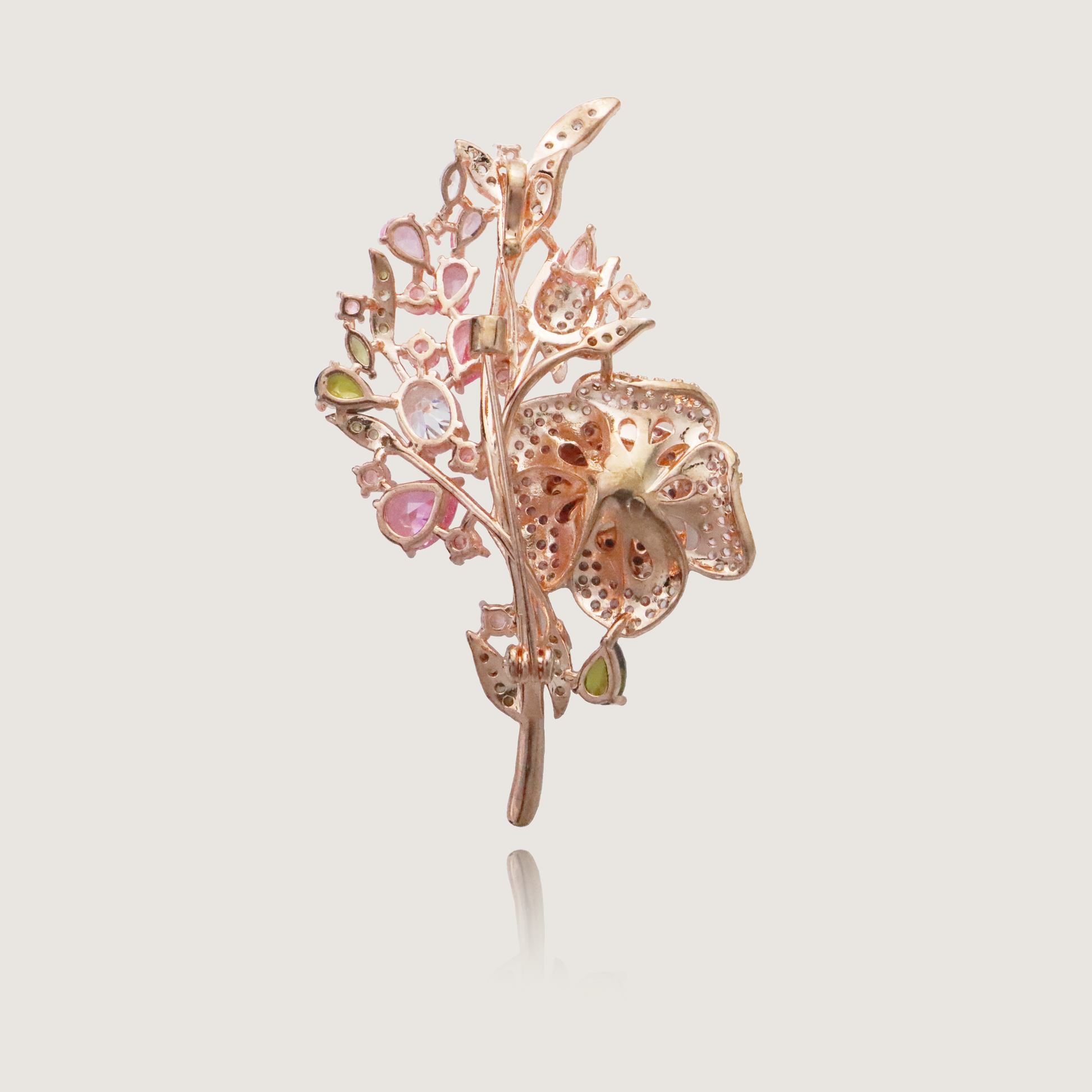 Charming floral pin encrusted with diamonds and pink gemstone accents