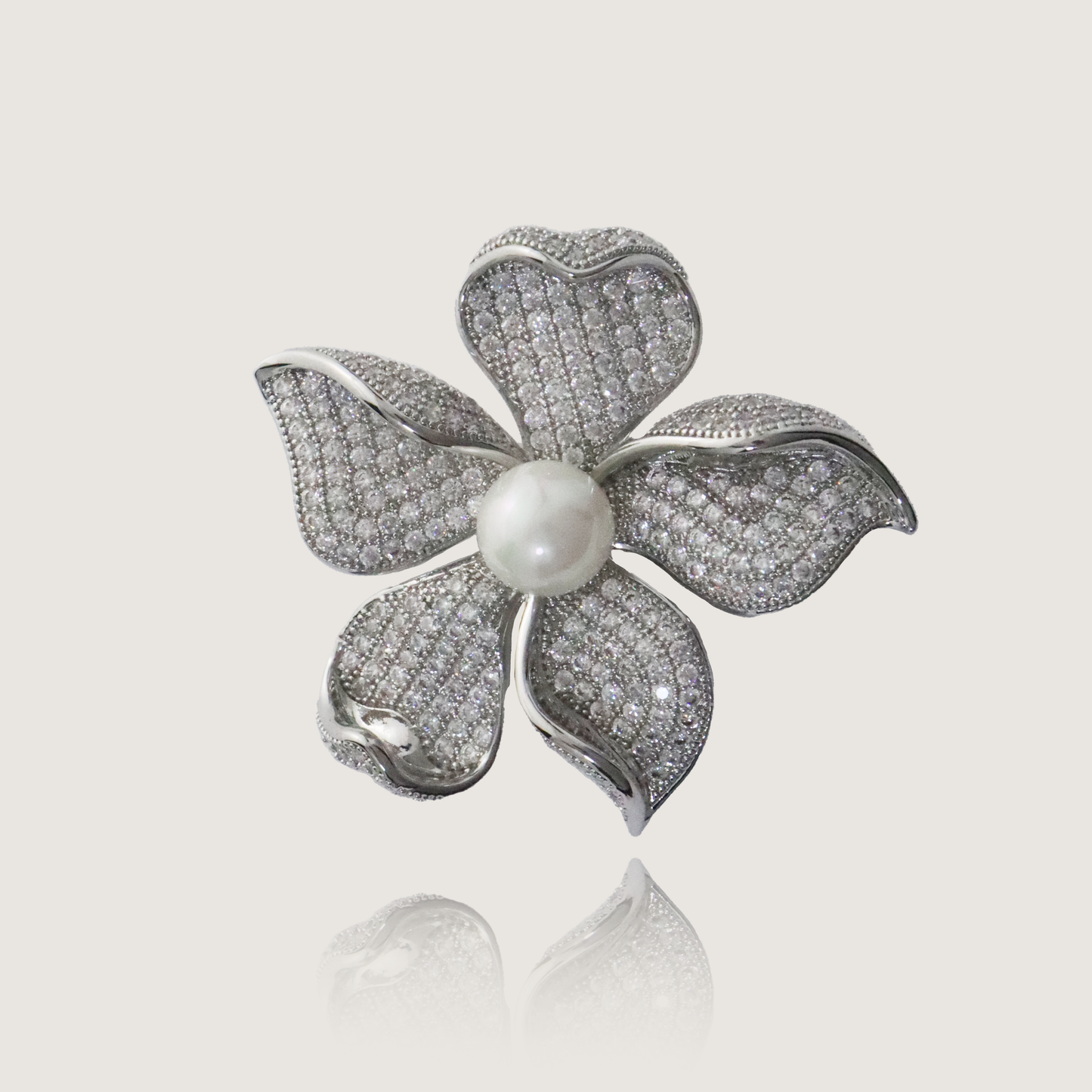 Chic silver floral brooch with cubic zirconia petals and lustrous pearl center