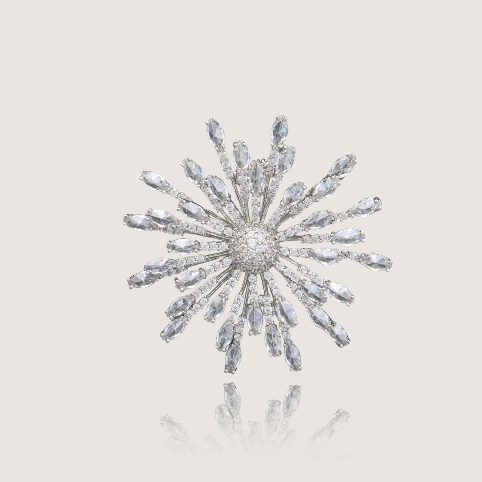 Dazzling silver starburst pin with crystalline rays and pavé core