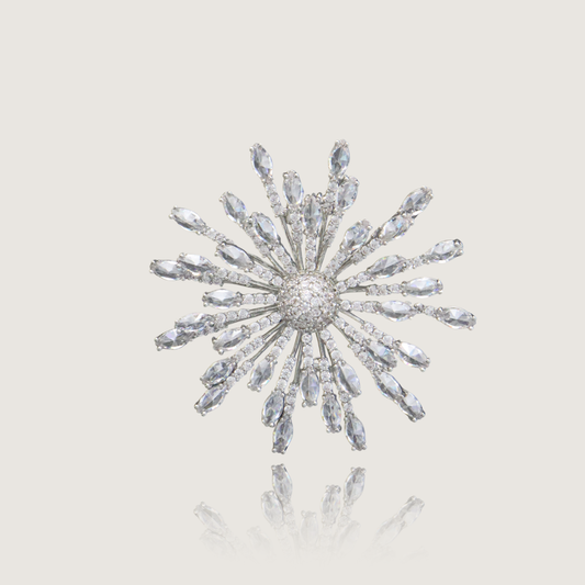 Dazzling silver starburst pin with crystalline rays and pavé core