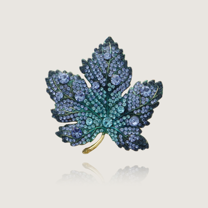 Elegant blue crystal maple leaf pin with gradient gemstone hues