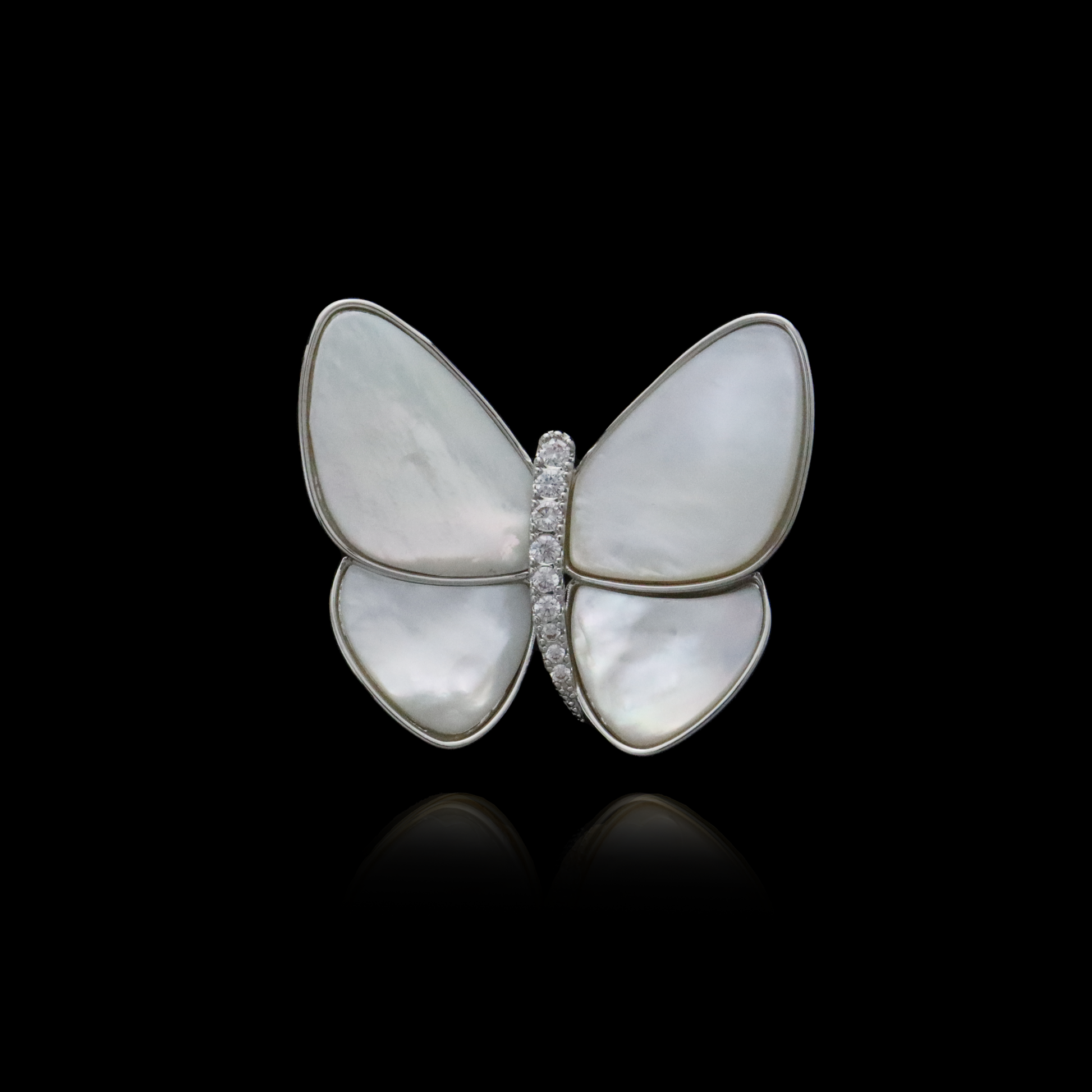 Elegant white butterfly pin with lustrous wings and a diamond center