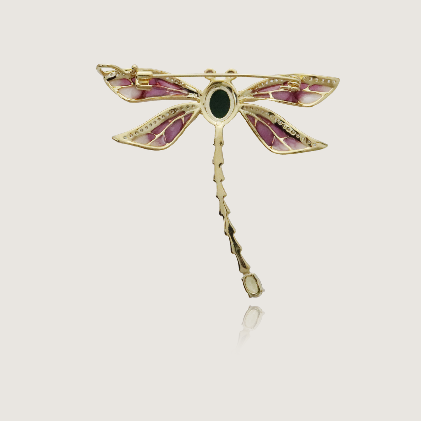 Enchanting dragonfly pin with enamel wings, diamond details, and a vivid green body