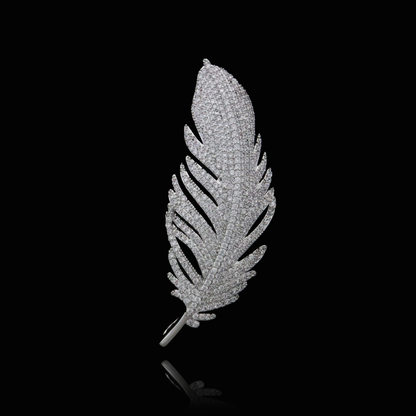 Exquisite feather brooch encrusted with a myriad of small diamonds, showcasing luxury