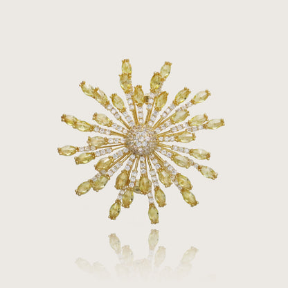 Glimmering golden sunflower brooch with crystal embellishments and a central pavé.