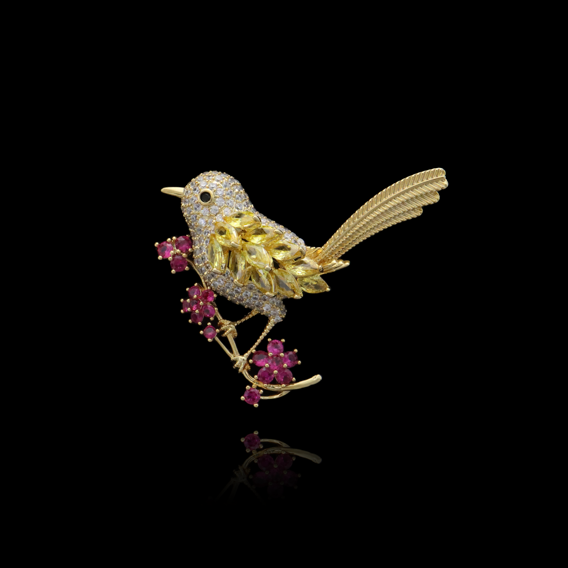 Gold bird pin adorned with canary yellow crystals and ruby blossoms.