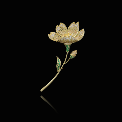 Golden Lotus Brooch with Green Gemstone Accents and Diamonds