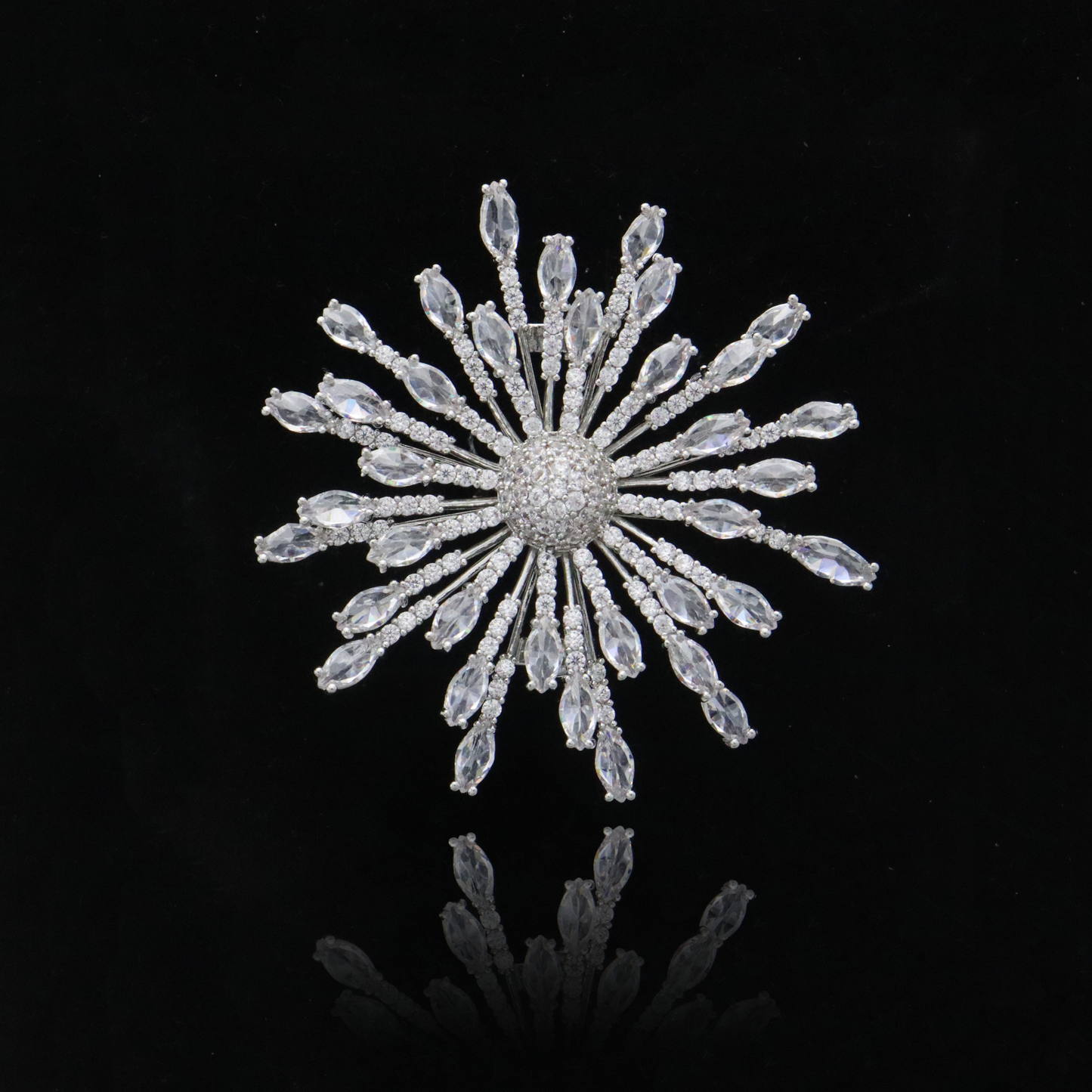 Icy crystal snowflake brooch with elegant marquise stones radiating from the center