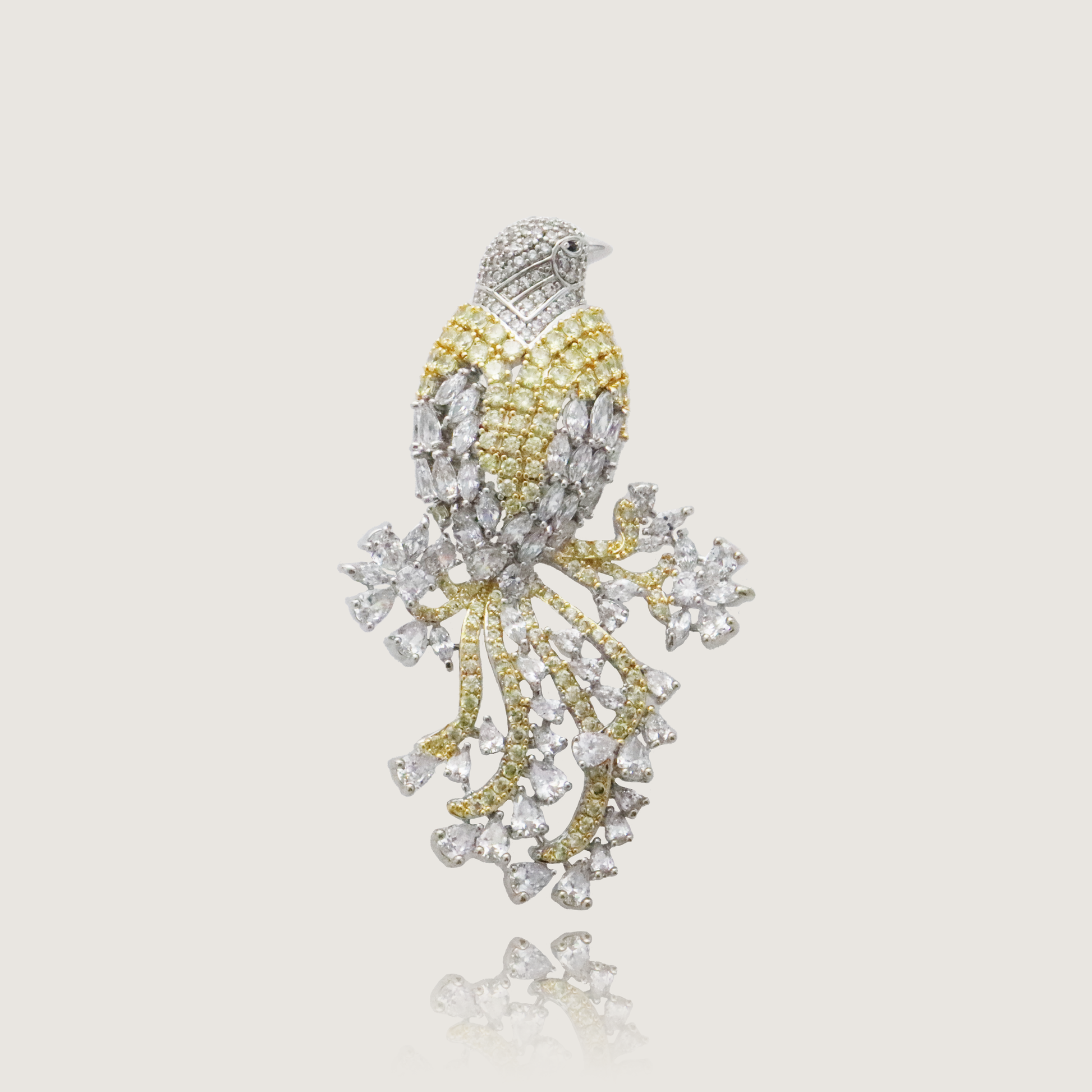 Elegant bird brooch with diamond plumage and yellow gold accents