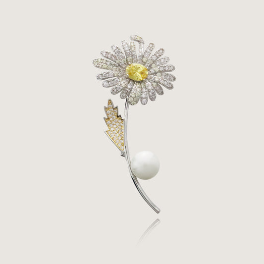 Luxury sunflower brooch in gold with diamond encrustations and a single pearl