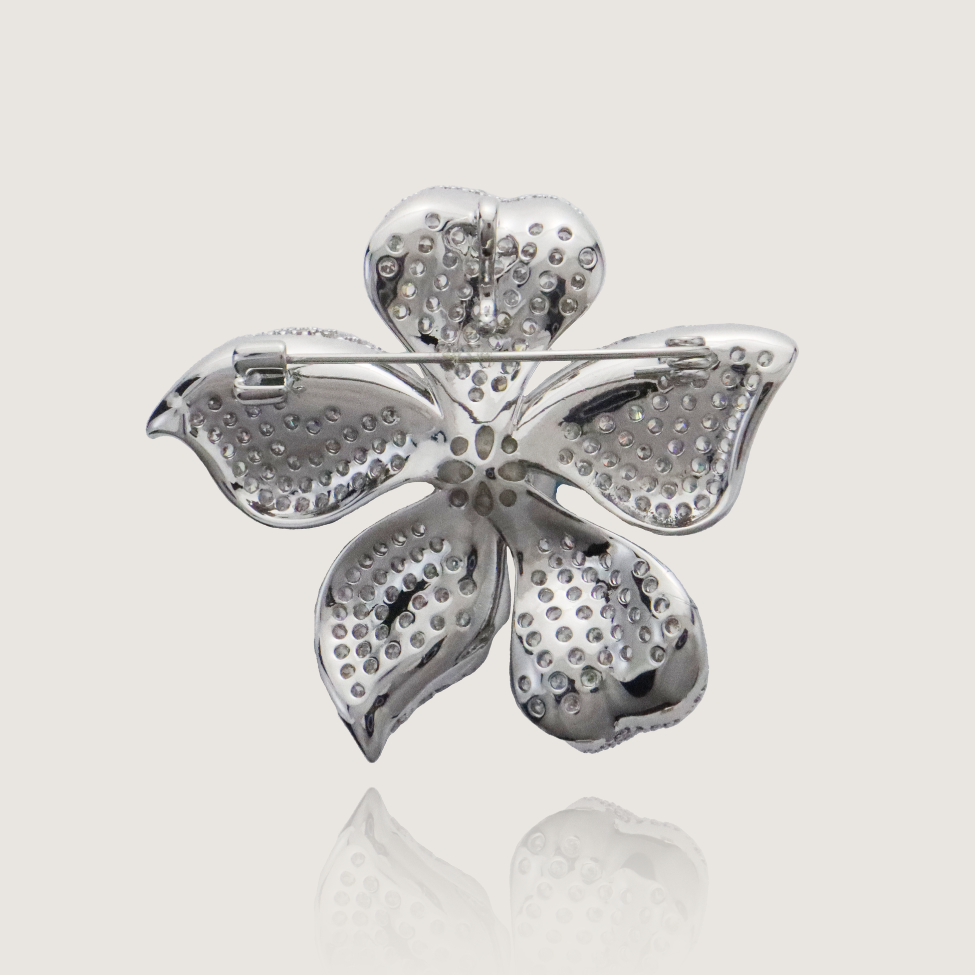 Silver petal brooch with CZ diamond pavé and pearl, perfect for adding a touch of glamour.