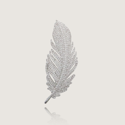 Sophisticated diamond feather pin offering a sparkling touch to any ensemble