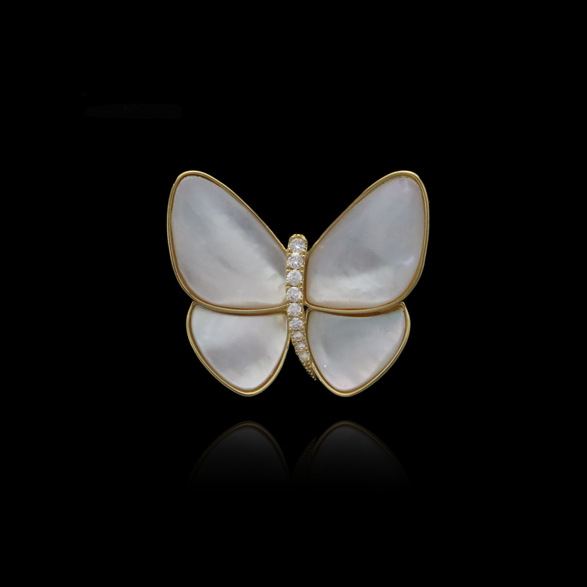 Sophisticated white and gold butterfly brooch with a central line of diamonds