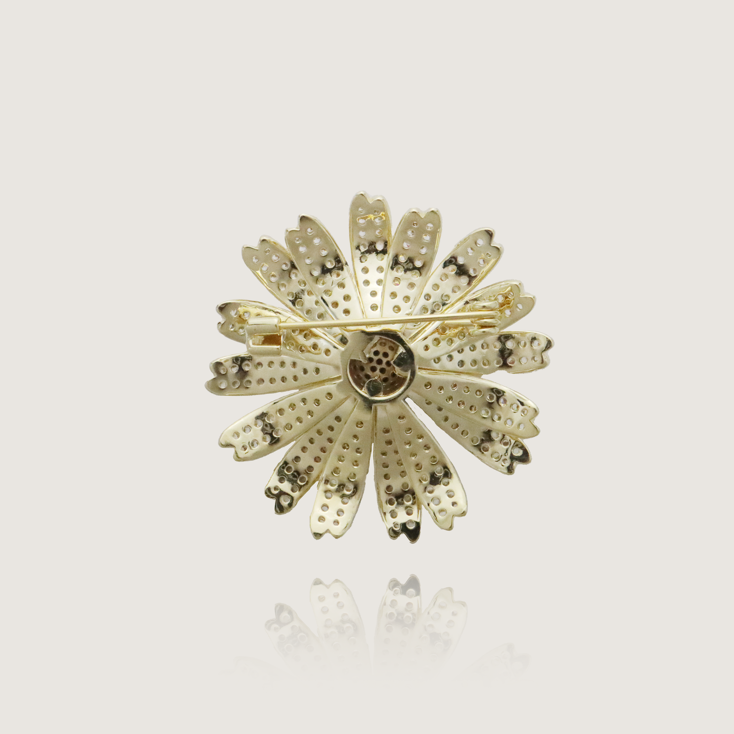 Sparkling flower pin with diamonds set in a gold petal design