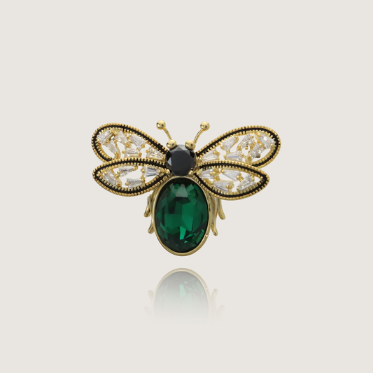 Vintage bee brooch with green gemstone body and delicate diamond wings