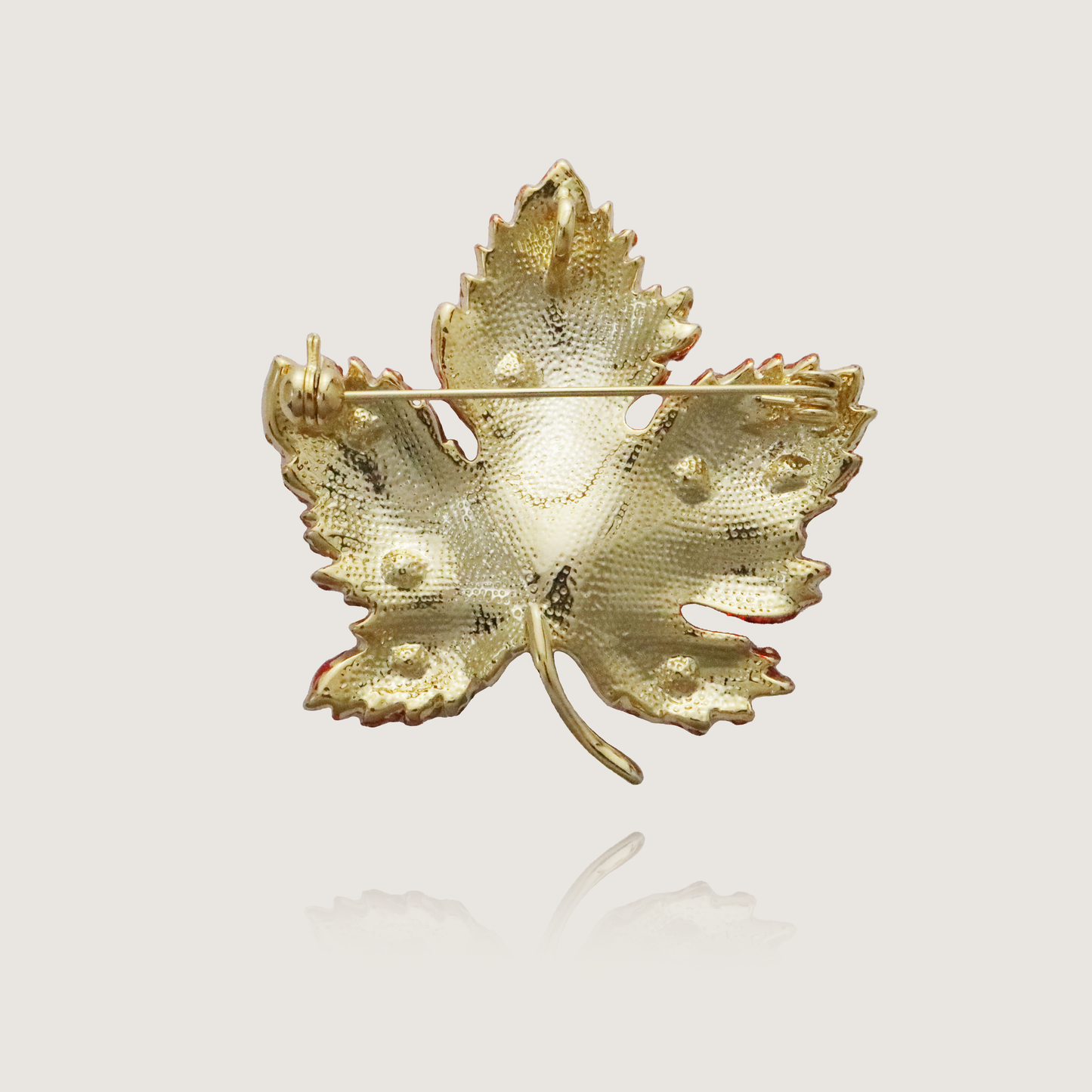 Vivid red gemstone maple leaf brooch, a tribute to fall’s splendor